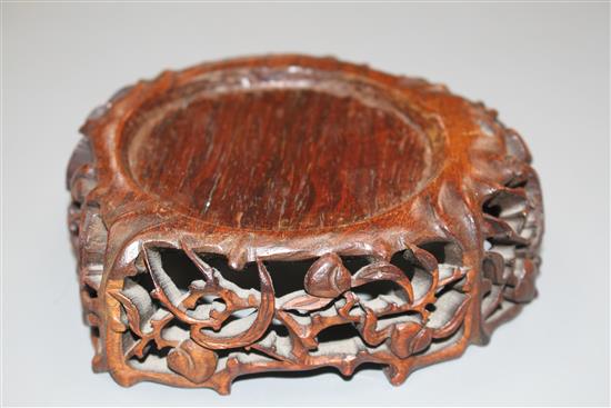 A Chinese pale celadon jade lotus cup, late Ming dynasty, W.13cm, associated wood stand